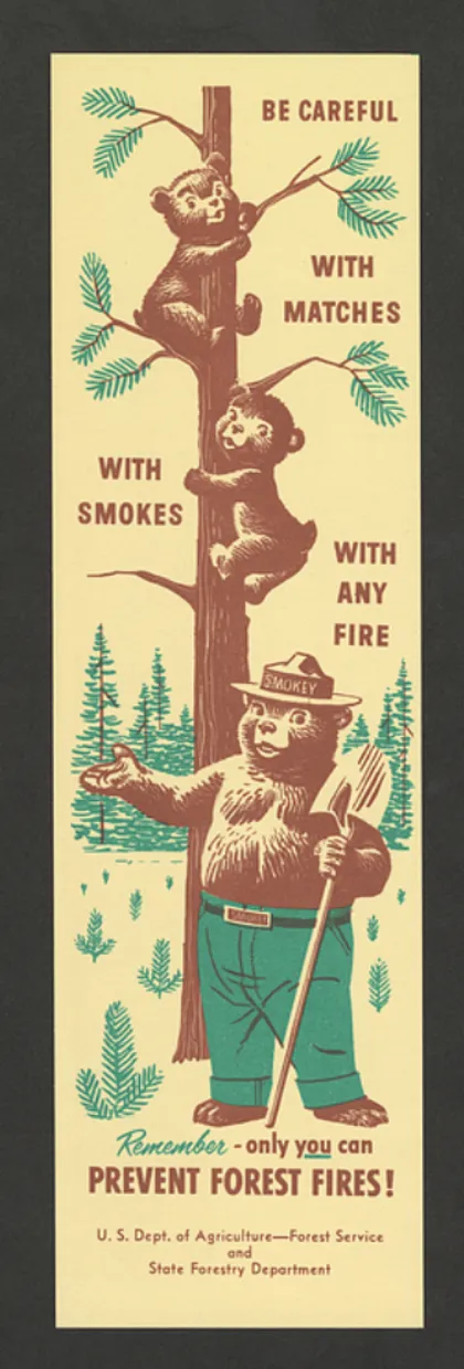 Regla con el logo "Ten cuidado con cerillos, con cigarros, con cualquier fuego" ["Be Careful with Matches, with Smokes, with Any Fire"] con un dibujo de dos osos cachorros trepando a un árbol y el oso Smokey parado frente al árbol. Al reverso, una regla de 8 pulgadas que se puede recortar y usar para medir. Debajo de la regla, en la parte posterior, hay cinco reglas importantes para recordar al manejar el fuego.