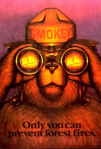 Cartel con el oso Smokey mirando un incendio a través de binoculares en el que se lee:  "Solo tú puedes prevenir los incendios forestales".